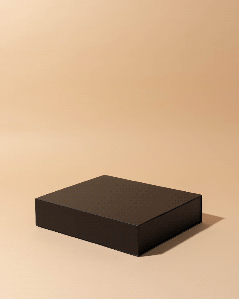 Video demonstration of black magnetic candle box opening and closing showing square compartments for 2.5oz candles