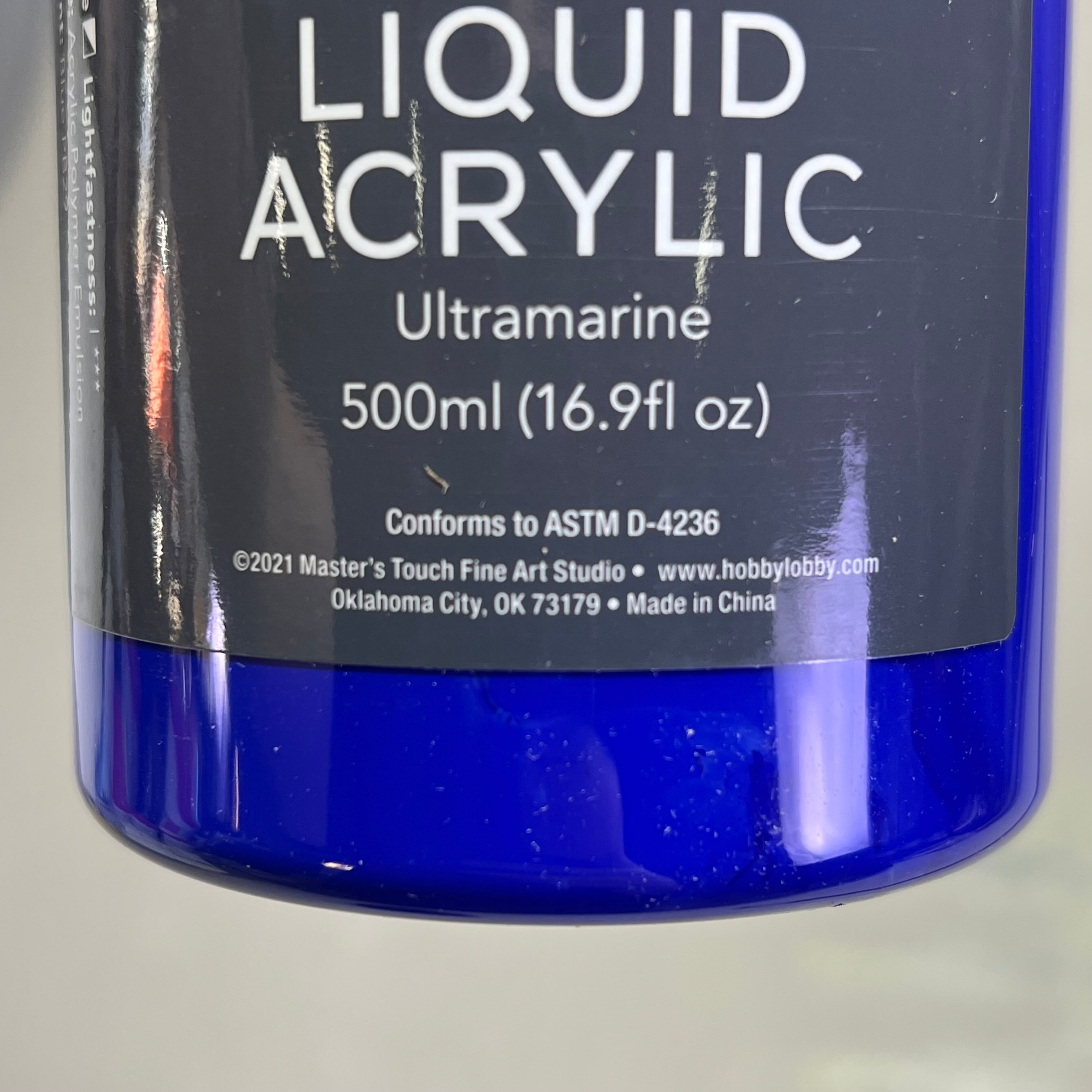 Bottom of Master's Touch Liquid Acrylic Paint label showing Ultramarine 500ml 16.9 fl oz on bottle