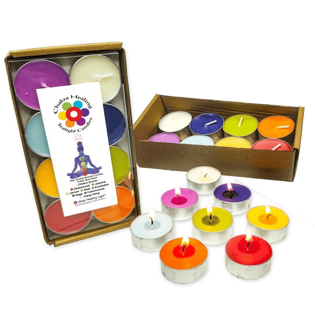Colorful chakra tealight candles in box with Chakra Healing label on white background