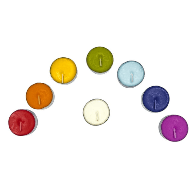 Set of 16 colorful chakra tealight candles on white background - top view