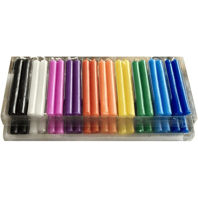 Set of 40 piece colorful assorted taper spell candles in clear plastic holder on white background - closeup view