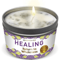 Lit Healing candle in tin labeled Return to Wholeness on white background