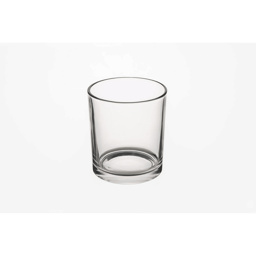 Empty clear glass candle jar on a white background
