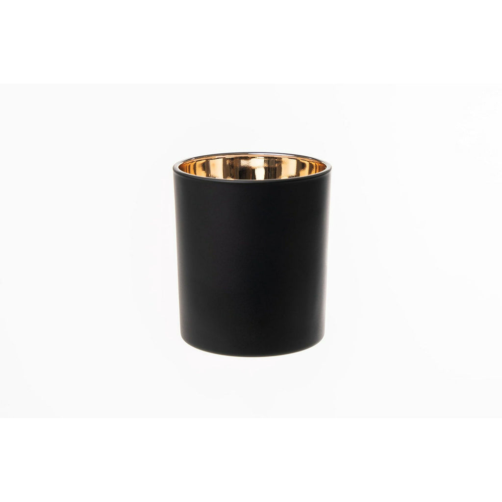 Black candle holder with gold interior on a white background - closeup view