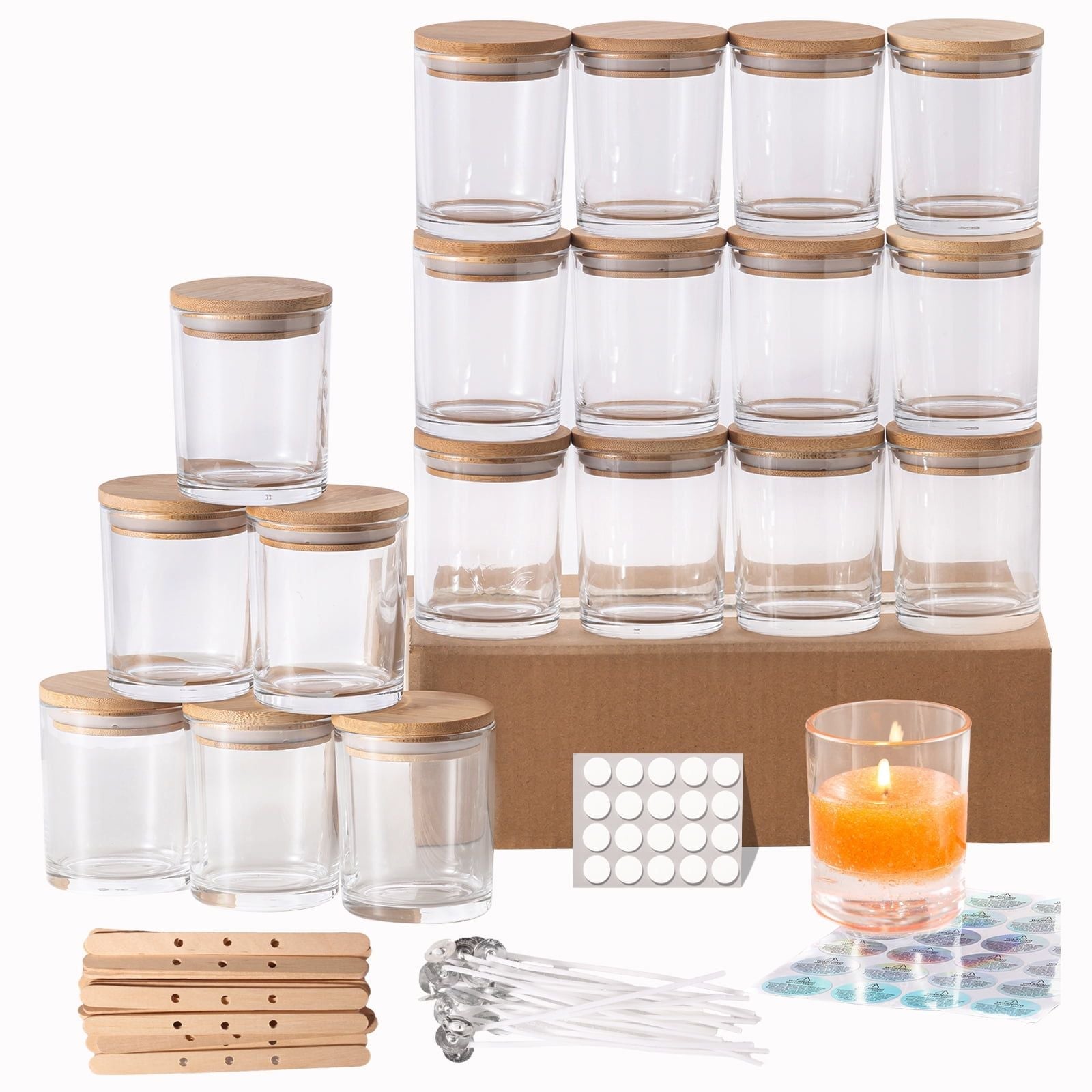 Set of clear stacked glass jars with bamboo wooden lids showing additional kit supplies on a white background