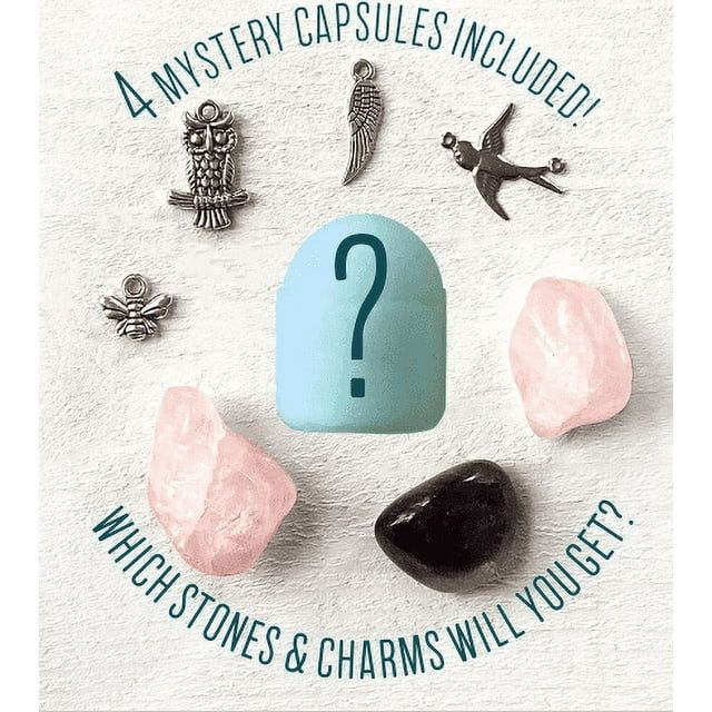 Mystery capsule with stones and charms on textured surface - hidden treasures from DIY candle kit