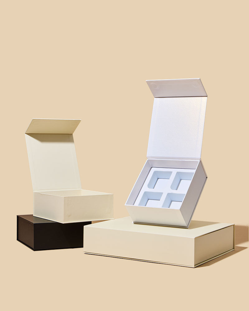 Three premium magnetic candle boxes in Pearl, Black, and Cream colors on beige background - 2.5oz candle gift packaging