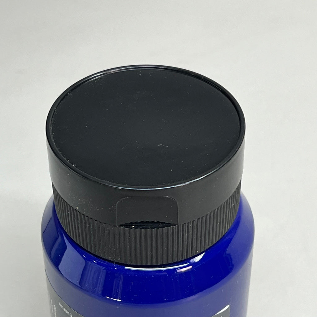 Close-up top view of Master's Touch Phthalo Blue acrylic paint bottle with black lid showing dark blue paint color through transparent plastic container on white background