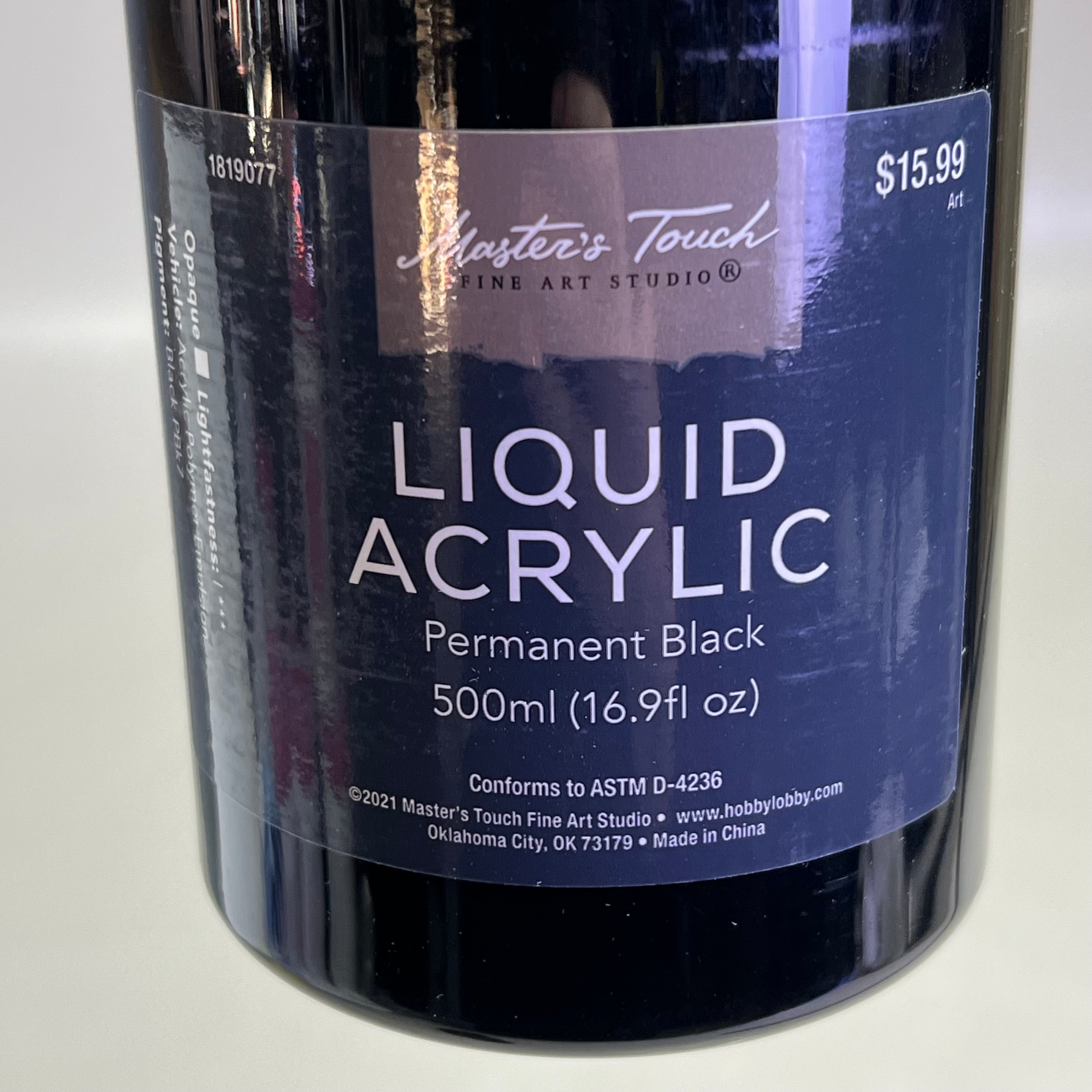 Close up of Master's Touch Liquid Acrylic Paint label showing Permanent Black 16.9 fl oz on white background - artist acrylic paint