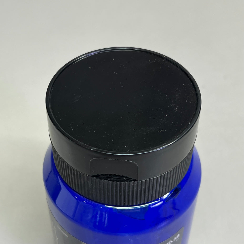 Close up of black bottle cap on Master's Touch ultramarine acrylic paint bottle on white background