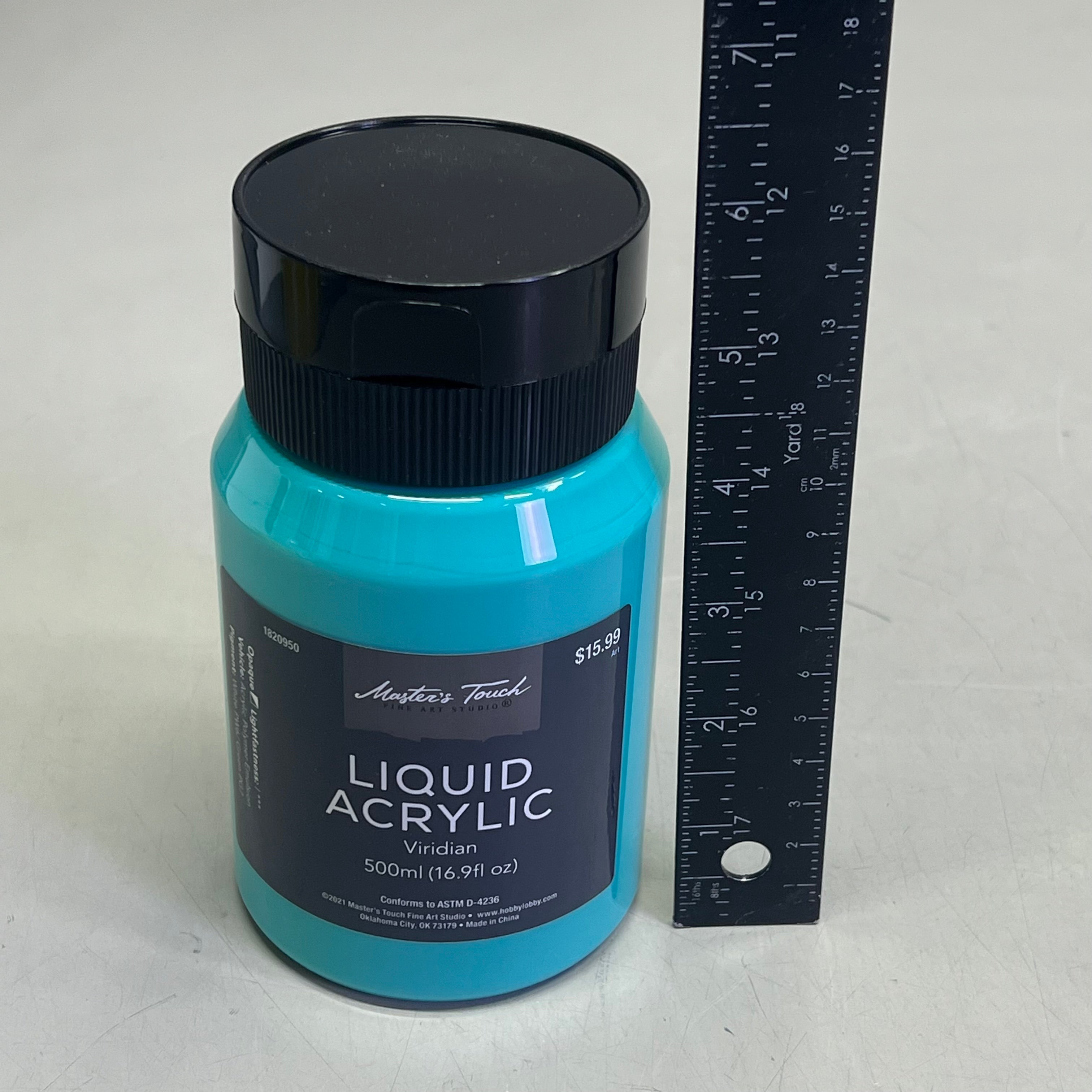 Master's Touch Liquid Acrylic Viridian paint bottle with black cap next to ruler showing size comparison on white background - 16.9 oz turquoise blue-green acrylic paint