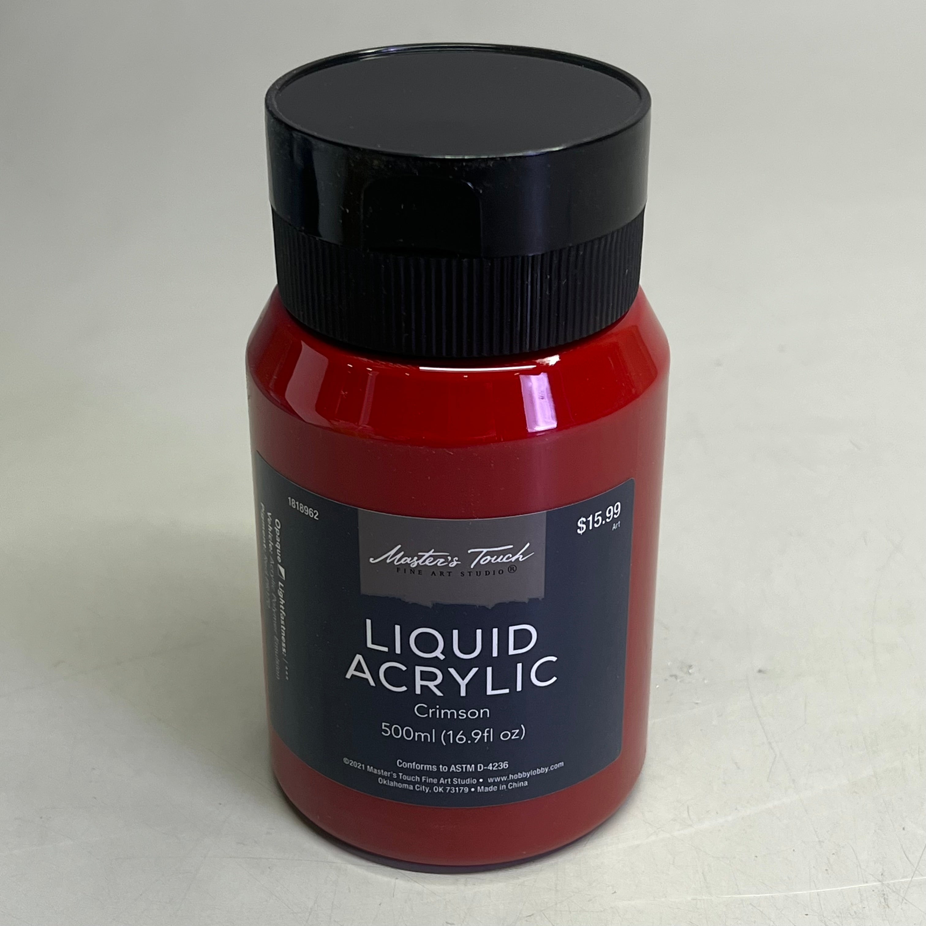 Single bottle of Master's Touch Liquid Acrylic Crimson paint in transparent plastic bottle showing red paint color on light gray background - liquid acrylic paint