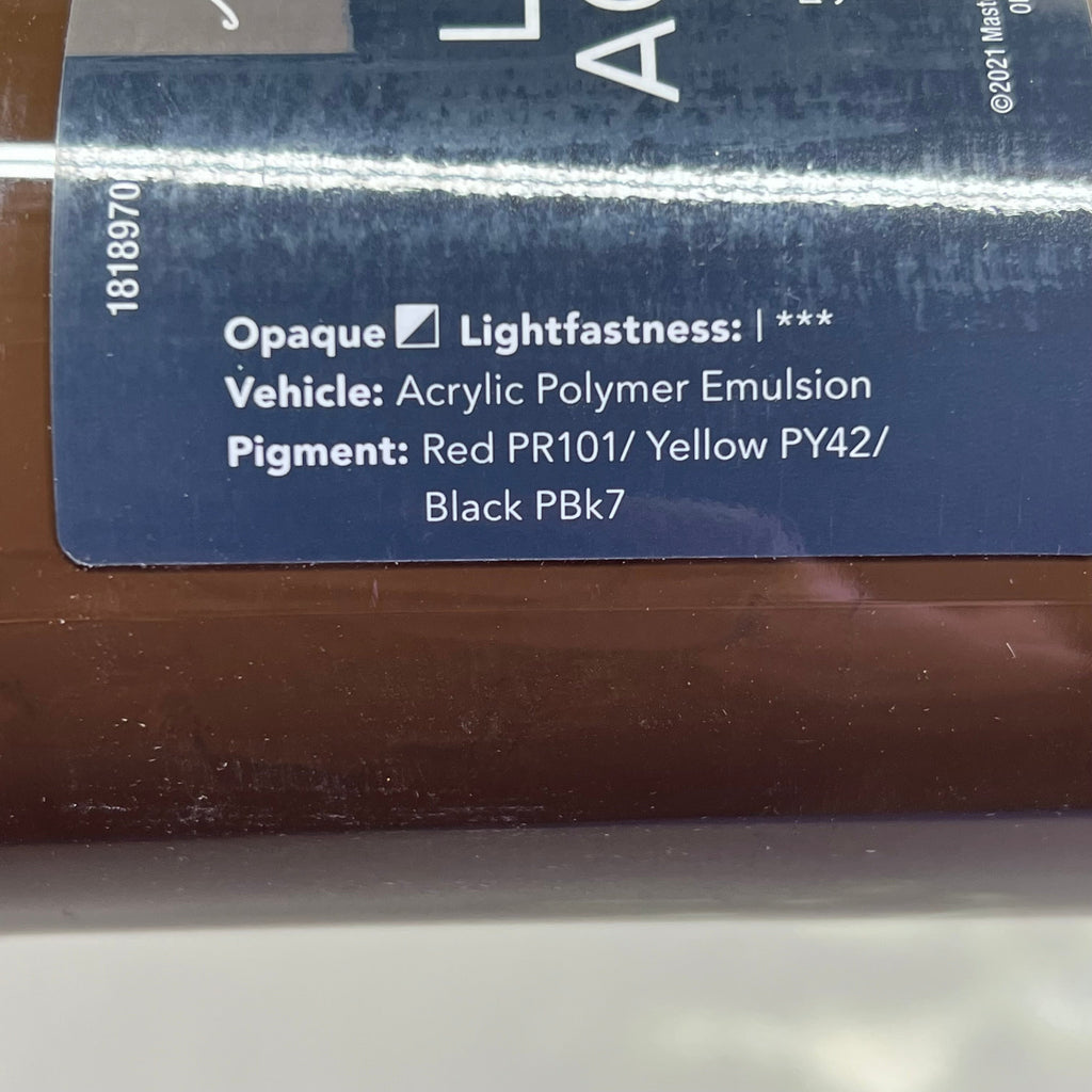 Close-up of brown paint label side with color information - Master's Touch Raw Umber acrylic paint details