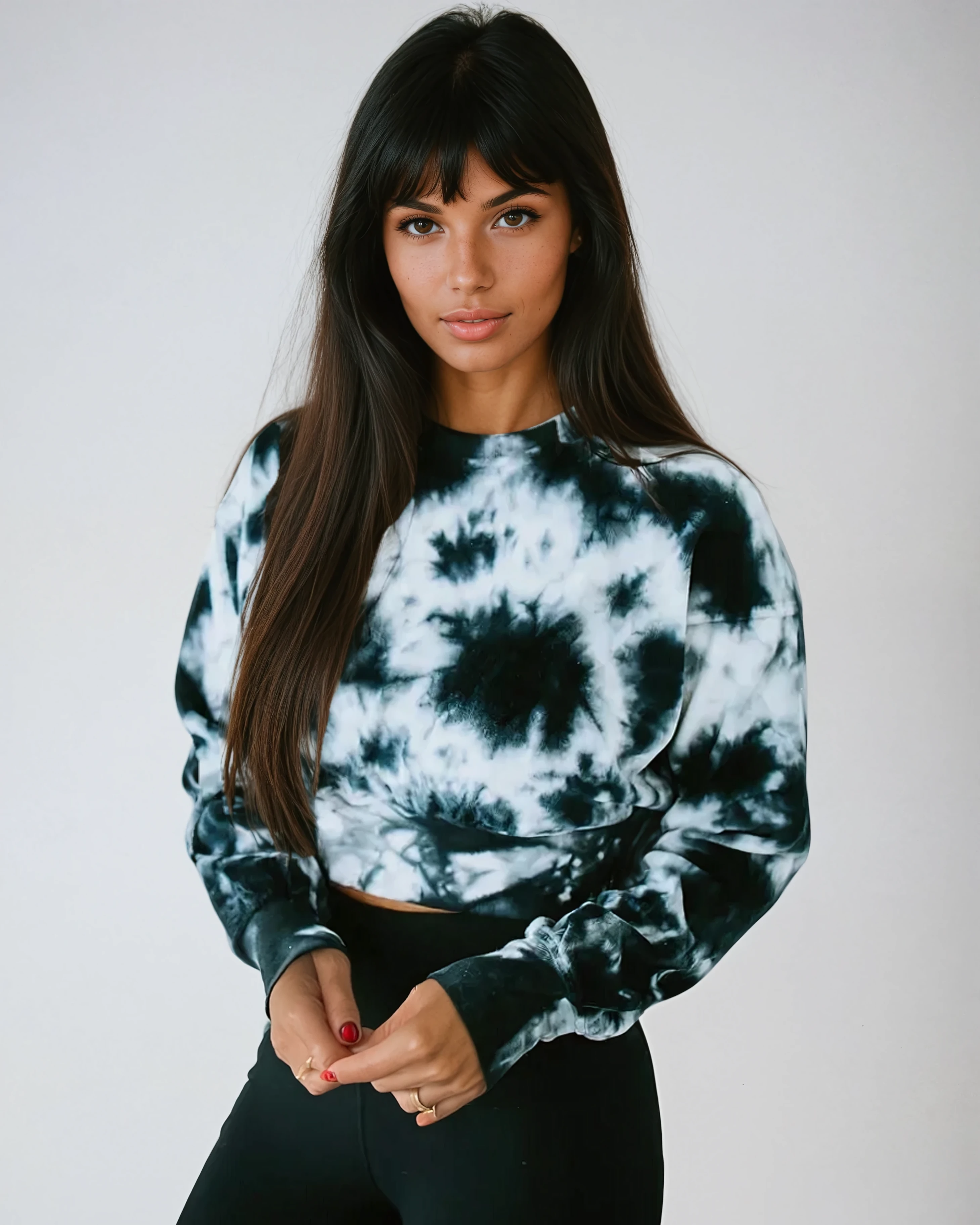 Woman wearing black and white midnight velvet tie-dye crop pullover sweatshirt against light background - athleisure wear by Fitkitty Culture