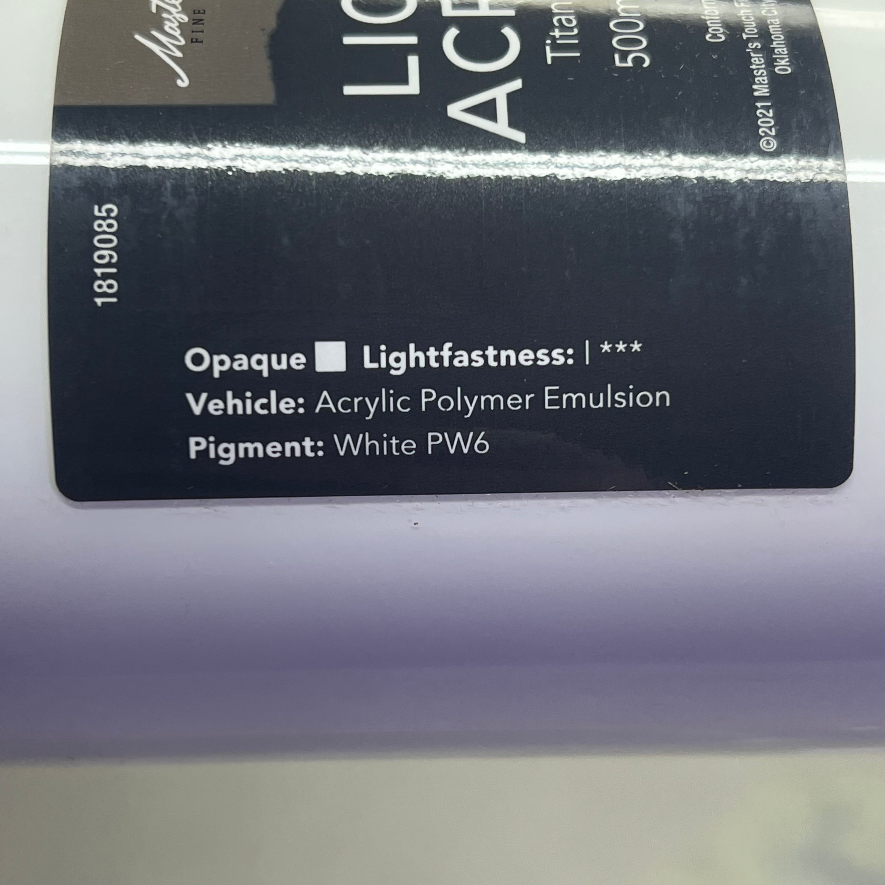 Close-up of white paint label side with color information - Master's Touch Titanium White acrylic paint details