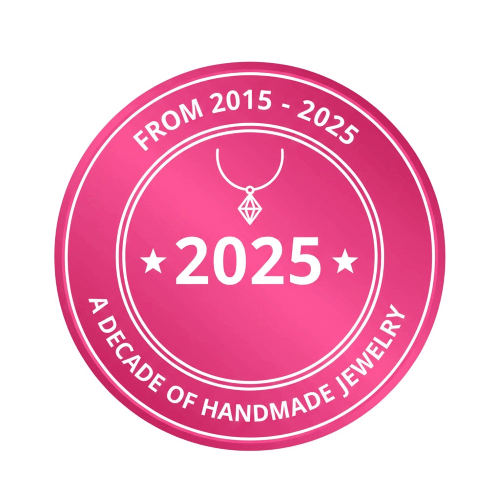 Pink badge with '2025' and 'A Decade of Handmade Jewelry' text on white background - Alexa Martha Designs anniversary logo