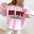 Person wearing pink Be My Valentine buffalo plaid crewneck sweatshirt taking selfie - Valentine's Day gift