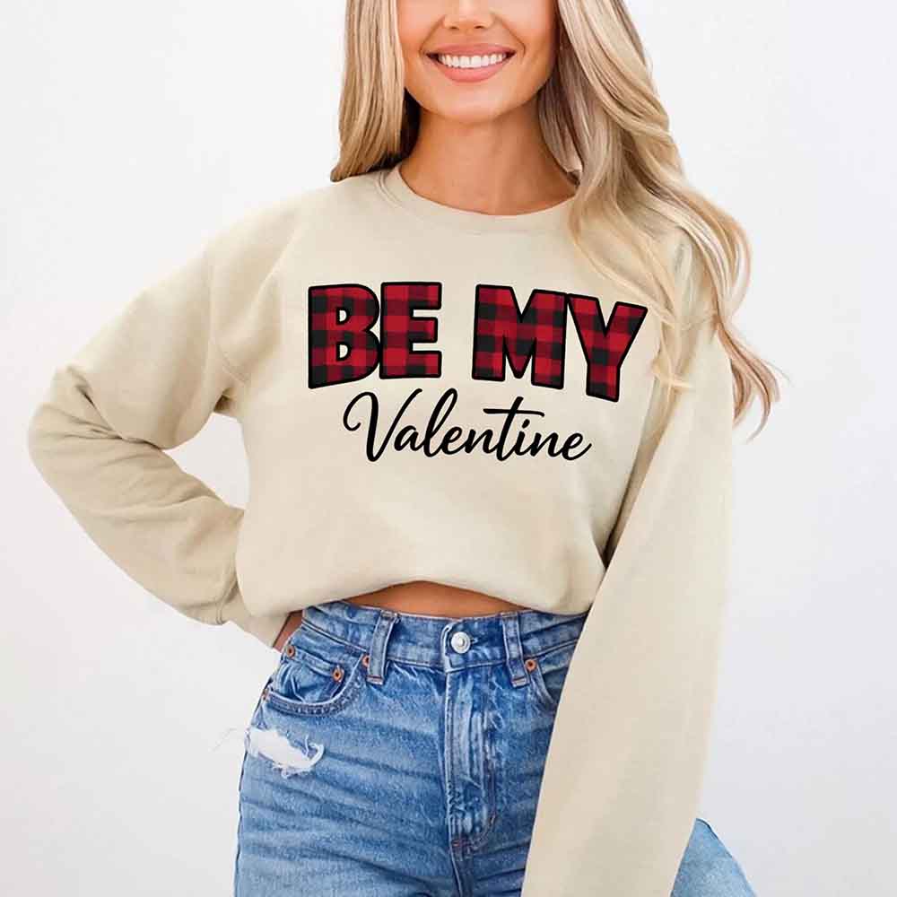 Person wearing sand beige Be My Valentine buffalo plaid crewneck sweatshirt - Valentine's Day casual wear