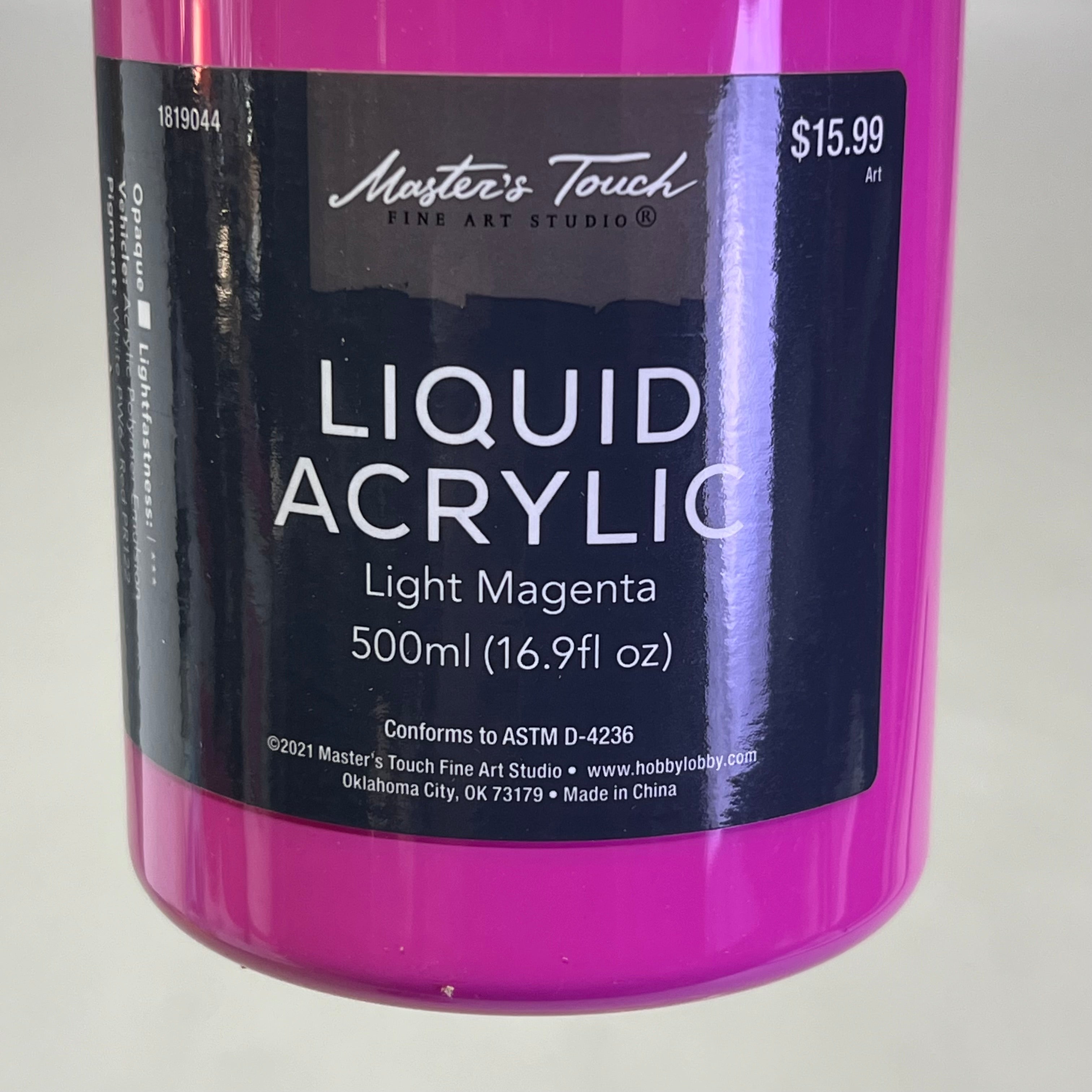 Close up of Master's Touch Liquid Acrylic Paint label showing Light Magenta 16.9 fl oz on white background - artist acrylic paint