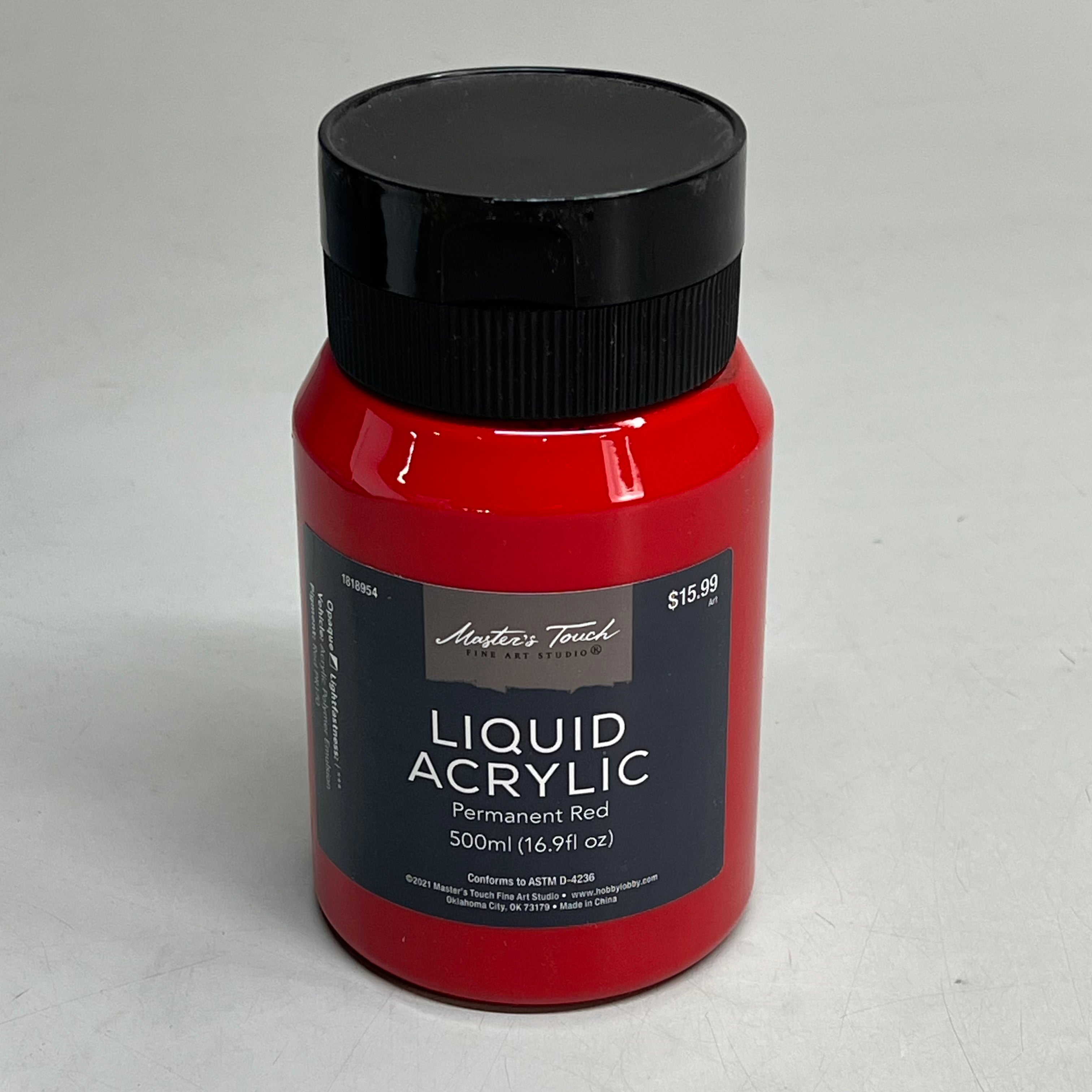 Red bottle of Master's Touch Liquid Acrylic Paint with black lid showing Permanent Red 16.9 fl oz on gray background