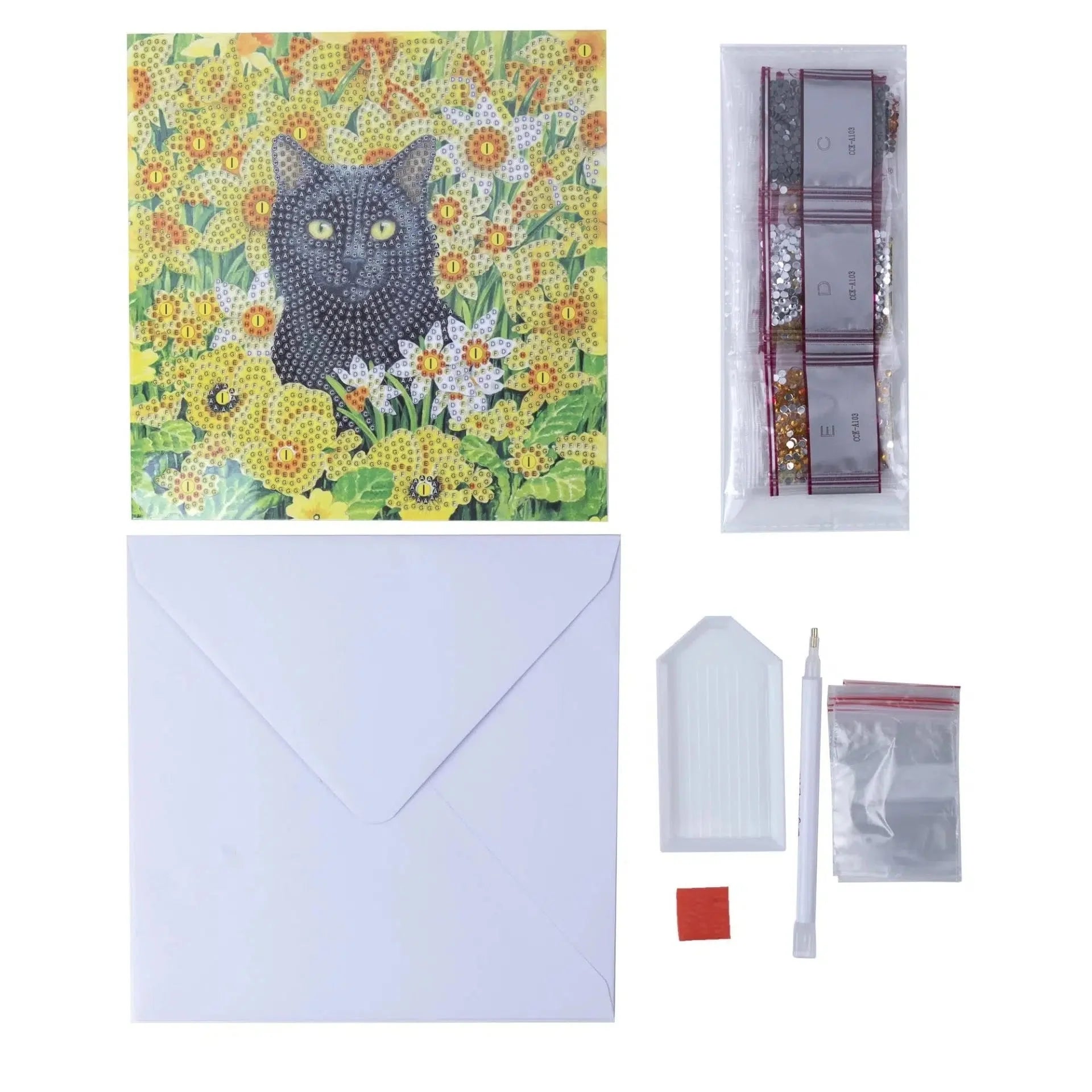 Diamond art cat greeting card with envelope, drill pen and tray, diamond art wax and resin gemstone packets on a white background