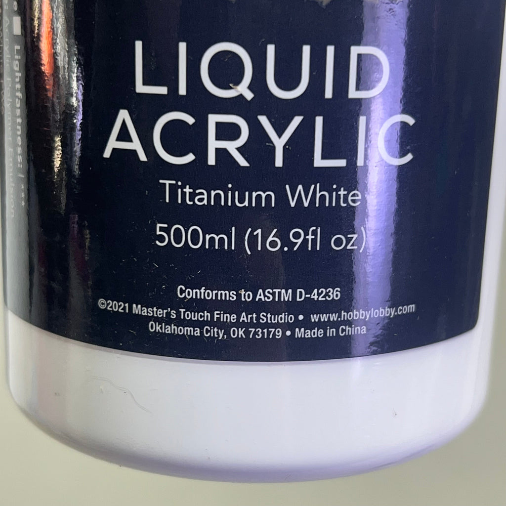 Bottom of Master's Touch Liquid Acrylic Paint label showing Titanium White 500ml 16.9 fl oz on white bottle