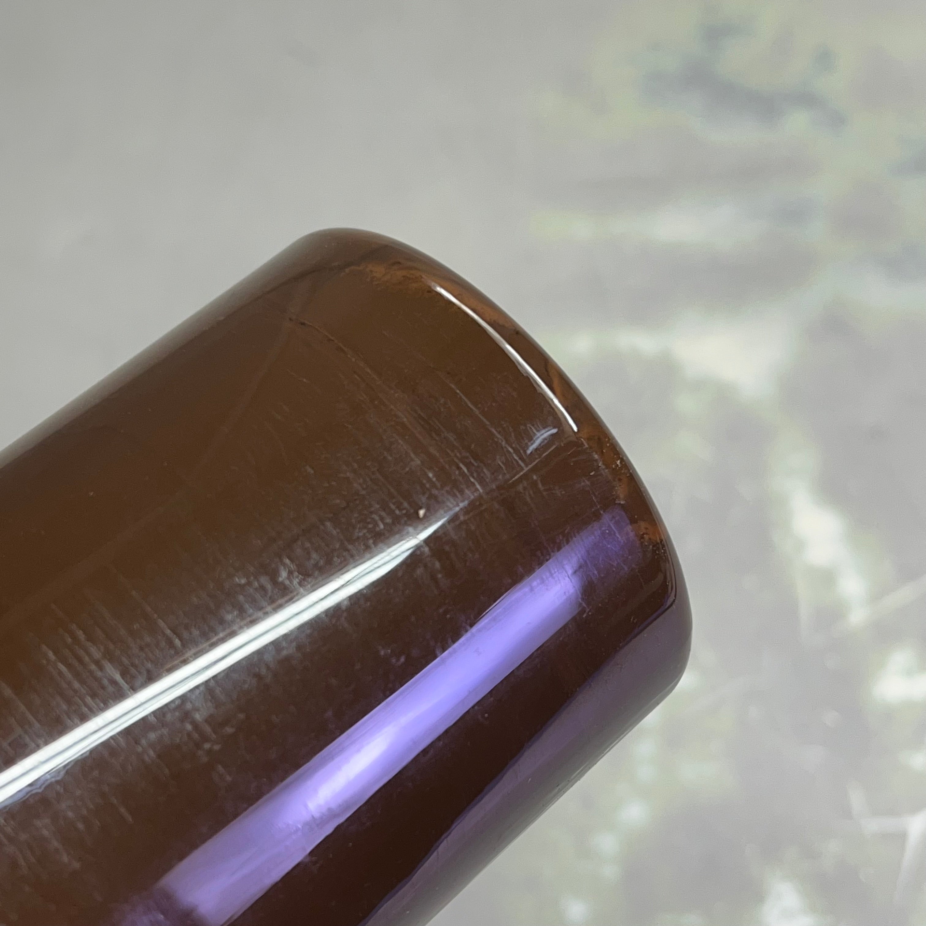 Upside down view of bottom of Master's Touch raw umber acrylic paint bottle - 16.9 fl oz