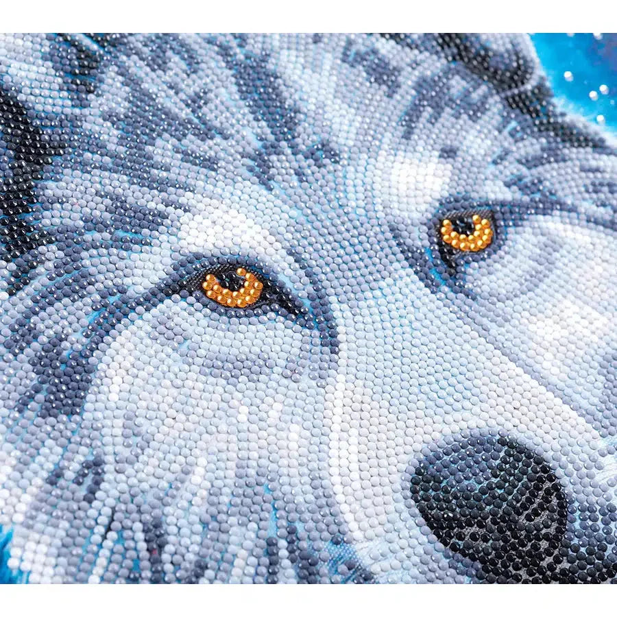 Close-up of Midnight Wolf diamond painting showing wolf face with orange eyes and sparkly crystal gemstone details