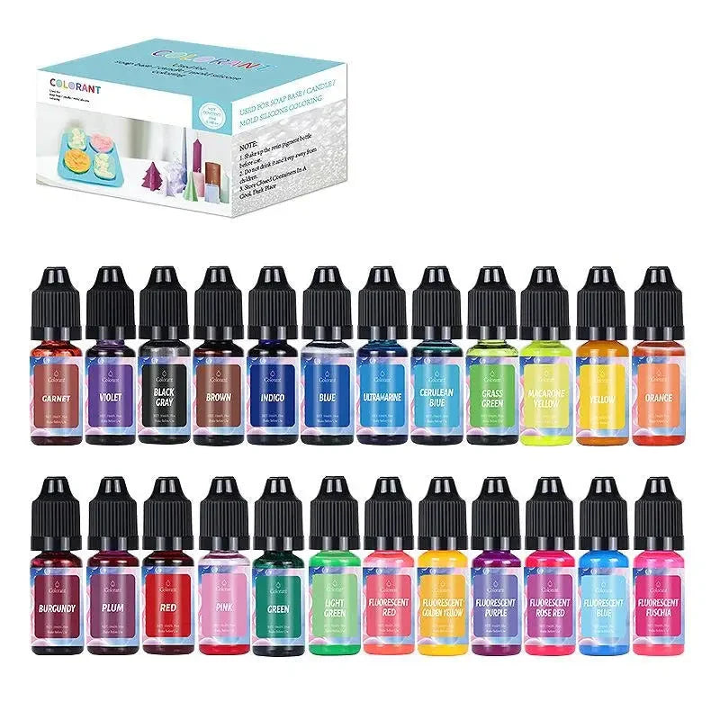 Set of 24 small bottles with colorful labels in front of a box labeled 'Colorant'.