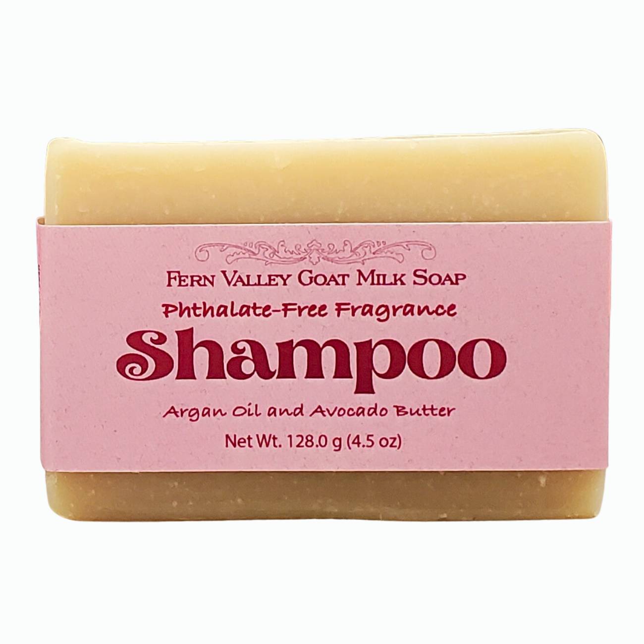 Natural bar of Handmade Goat Milk Shampoo with pink Fern Valley label on white background