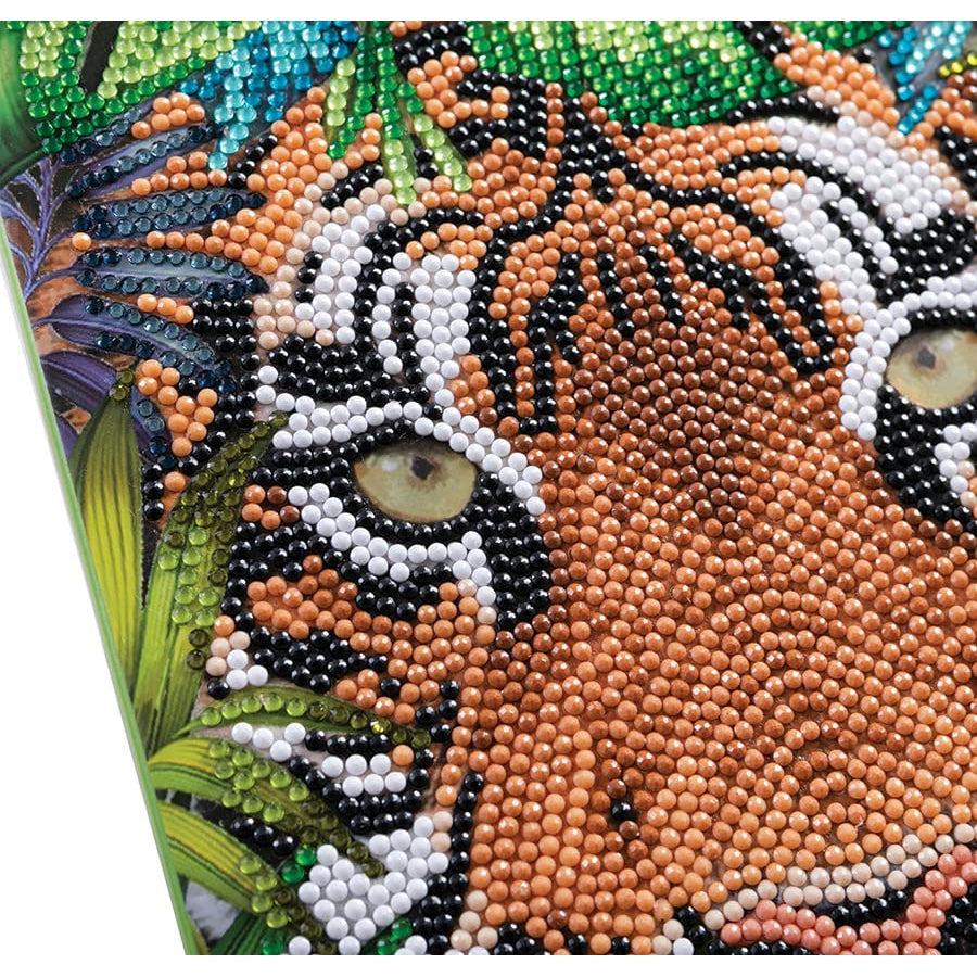 Close-up of tiger diamond painting design showing detailed sparkly gemstone placement on notebook cover