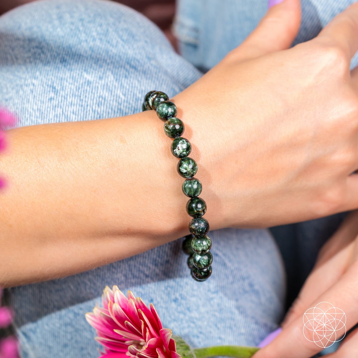 Person wearing green seraphinite beaded bracelet - rare stone of angels transformation jewelry