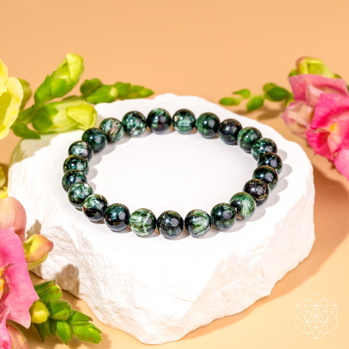 Green seraphinite beaded bracelet on white stone with flowers - angelic chakra jewelry