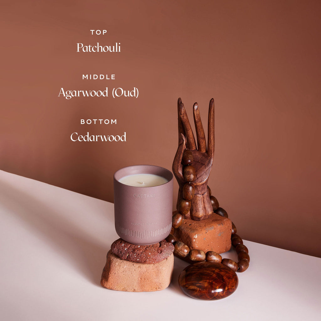 CAFTARI meditation candle with wooden sculpture on neutral background with scent information text