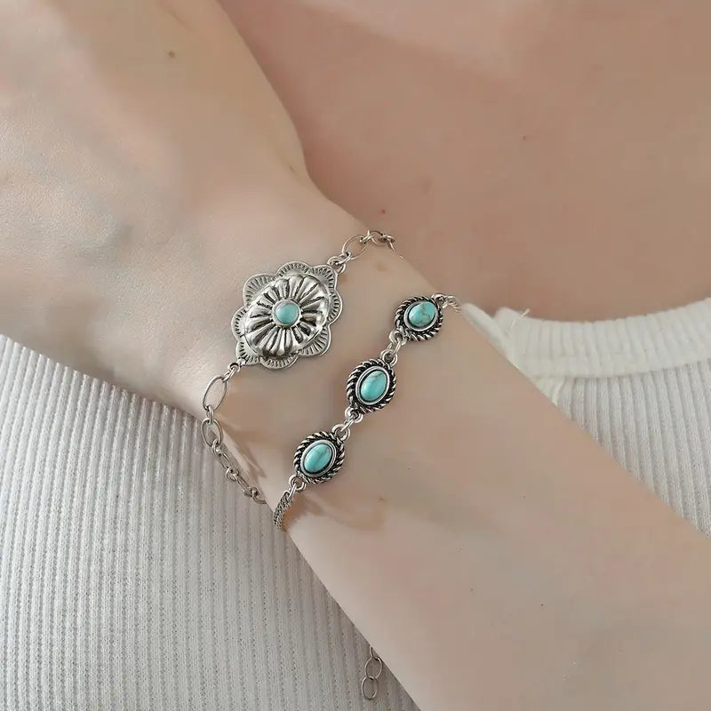 Silver bracelet with turquoise stones on wrist - western boho statement jewelry