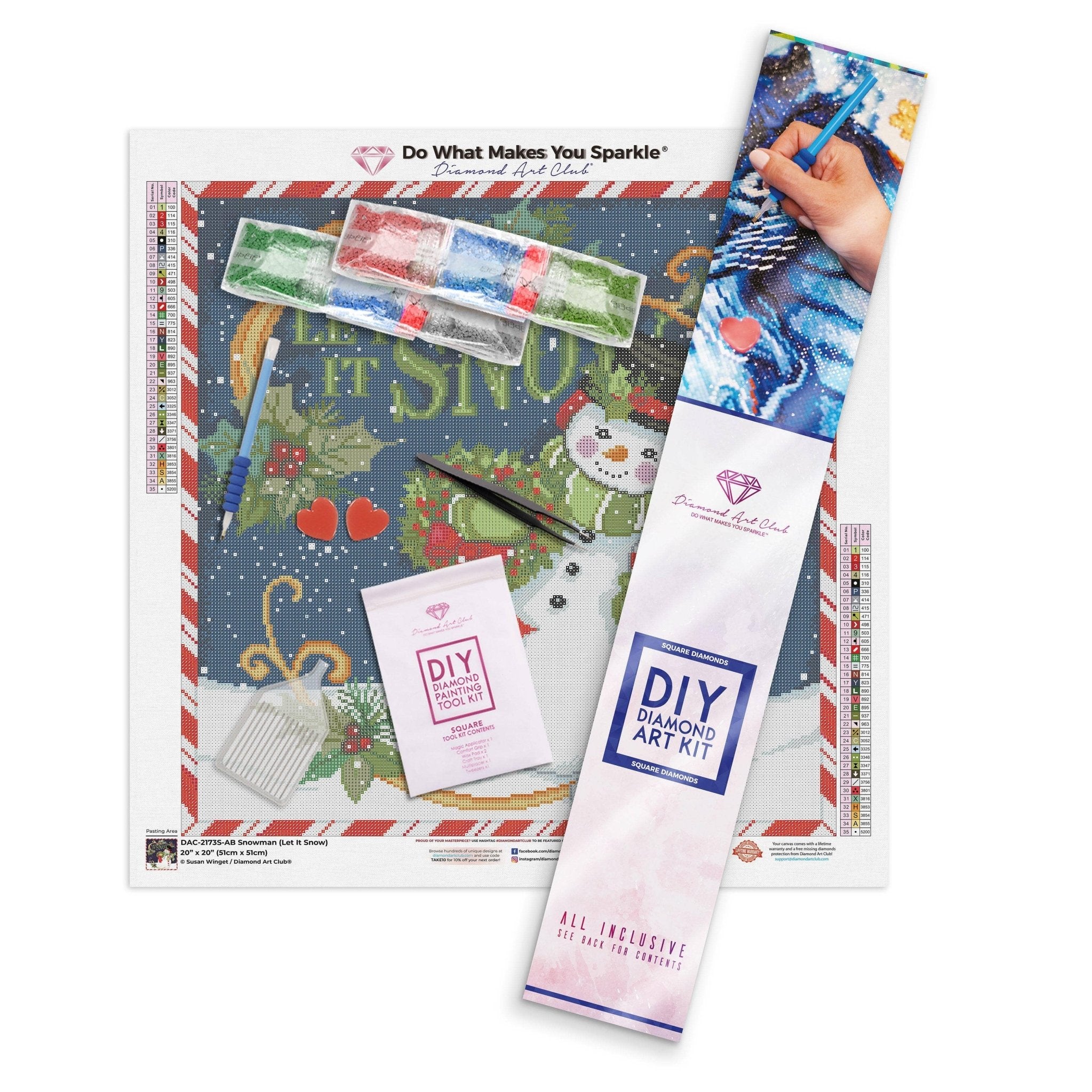 DIY diamond art kit with Christmas-themed design and tools on a white background