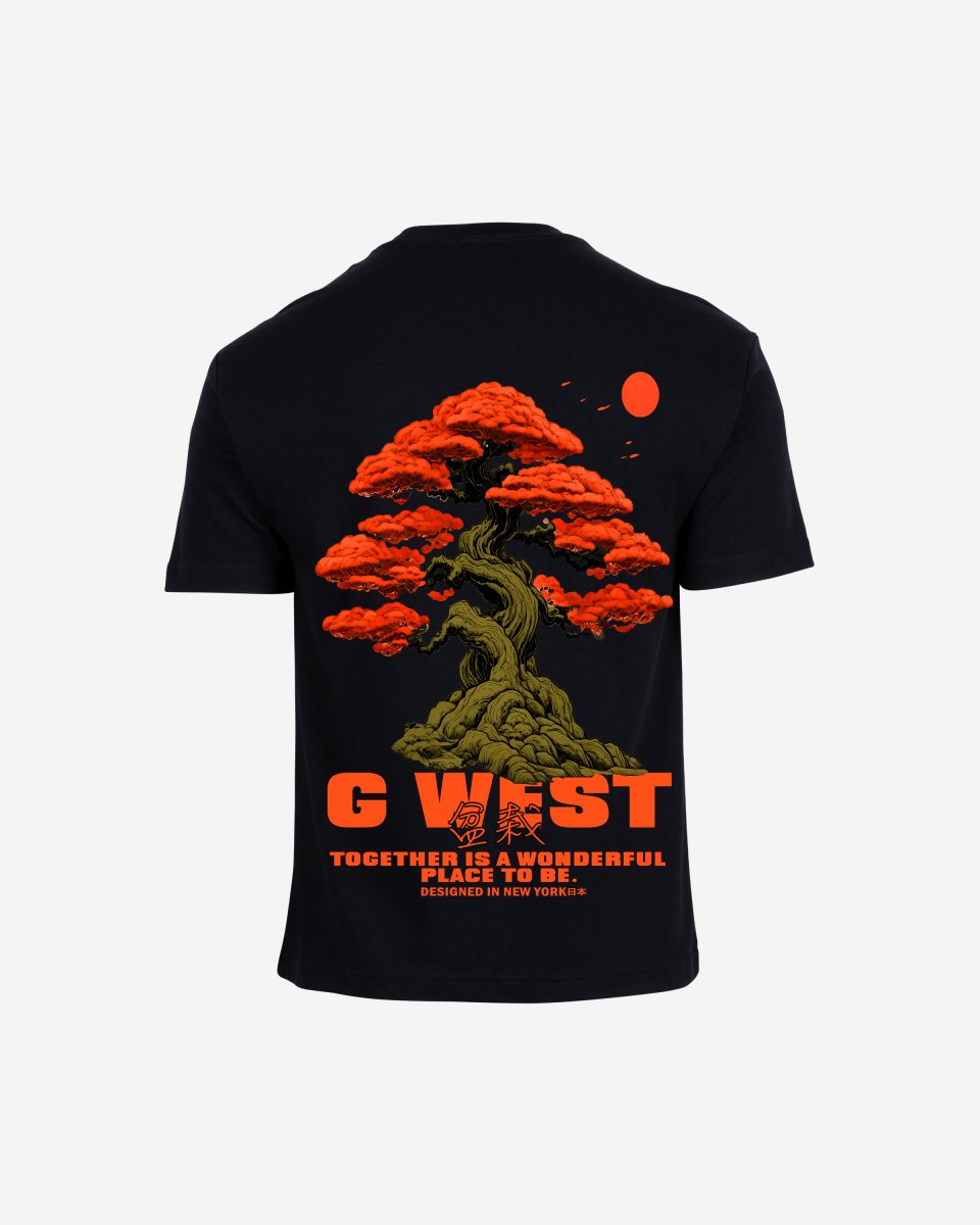 Close-up back view of black oversized t-shirt with bright orange bonsai tree and sun graphic featuring G West text on white background - premium cotton tee