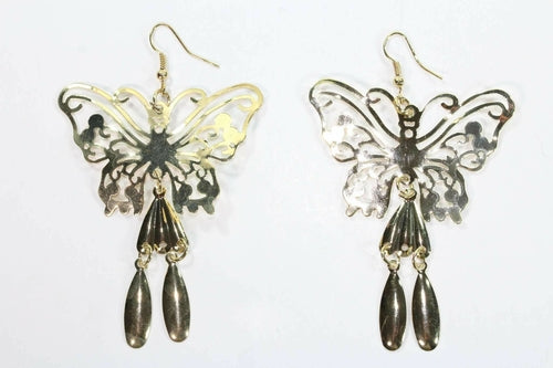 Butterfly-shaped earrings with dangling beads on a white background