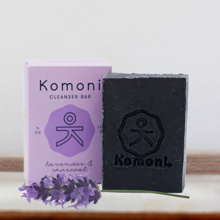 KOMONI black lavender charcoal cleansing bar and purple packaging - natural detoxifying soap with fresh lavender sprig