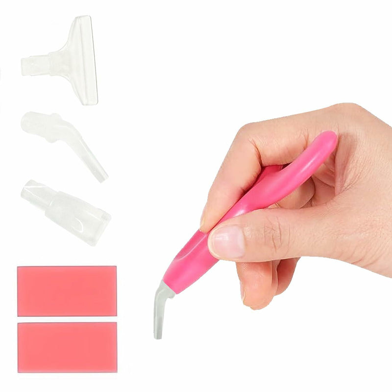 Pink ergonomic diamond art tool held by hand with 3 interchangeable attachments and wax on white background showing comfort grip design