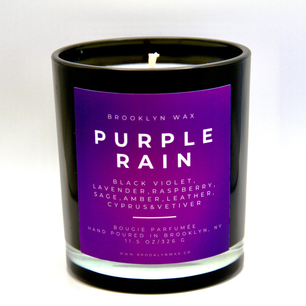 Purple Rain scented candle in black jar with purple label by Brooklyn Wax on white background