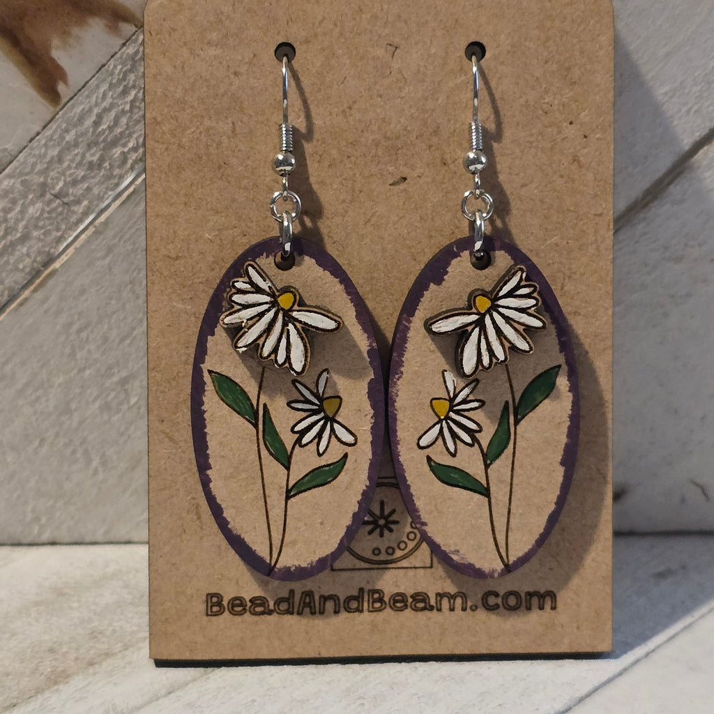 Handpainted Wooden daisy earrings on a BeadAndBeam.com branded card.