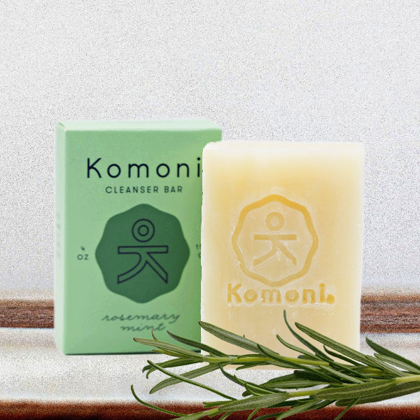 KOMONI rosemary mint cleansing bar - natural soap with eco-friendly packaging and fresh rosemary sprig