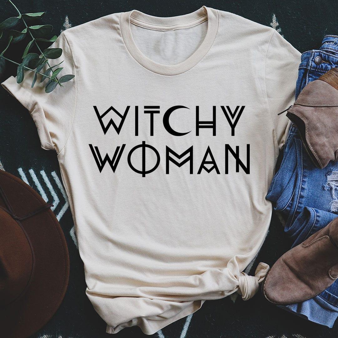 Soft cream Witchy Woman graphic t-shirt on textured surface with jeans and boots - witchy woman shirt